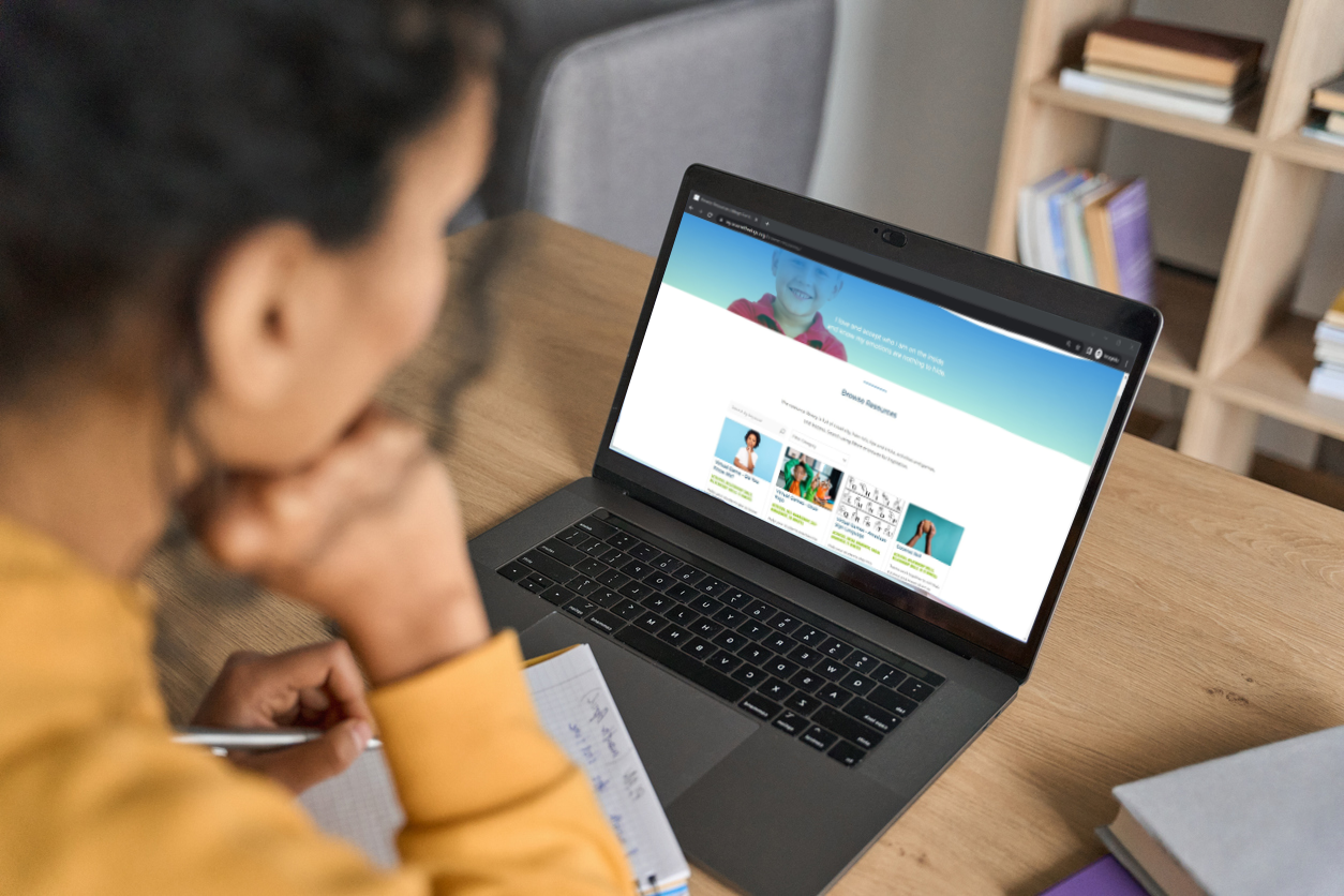 Female looks at her laptop with Digital Platform on the screen