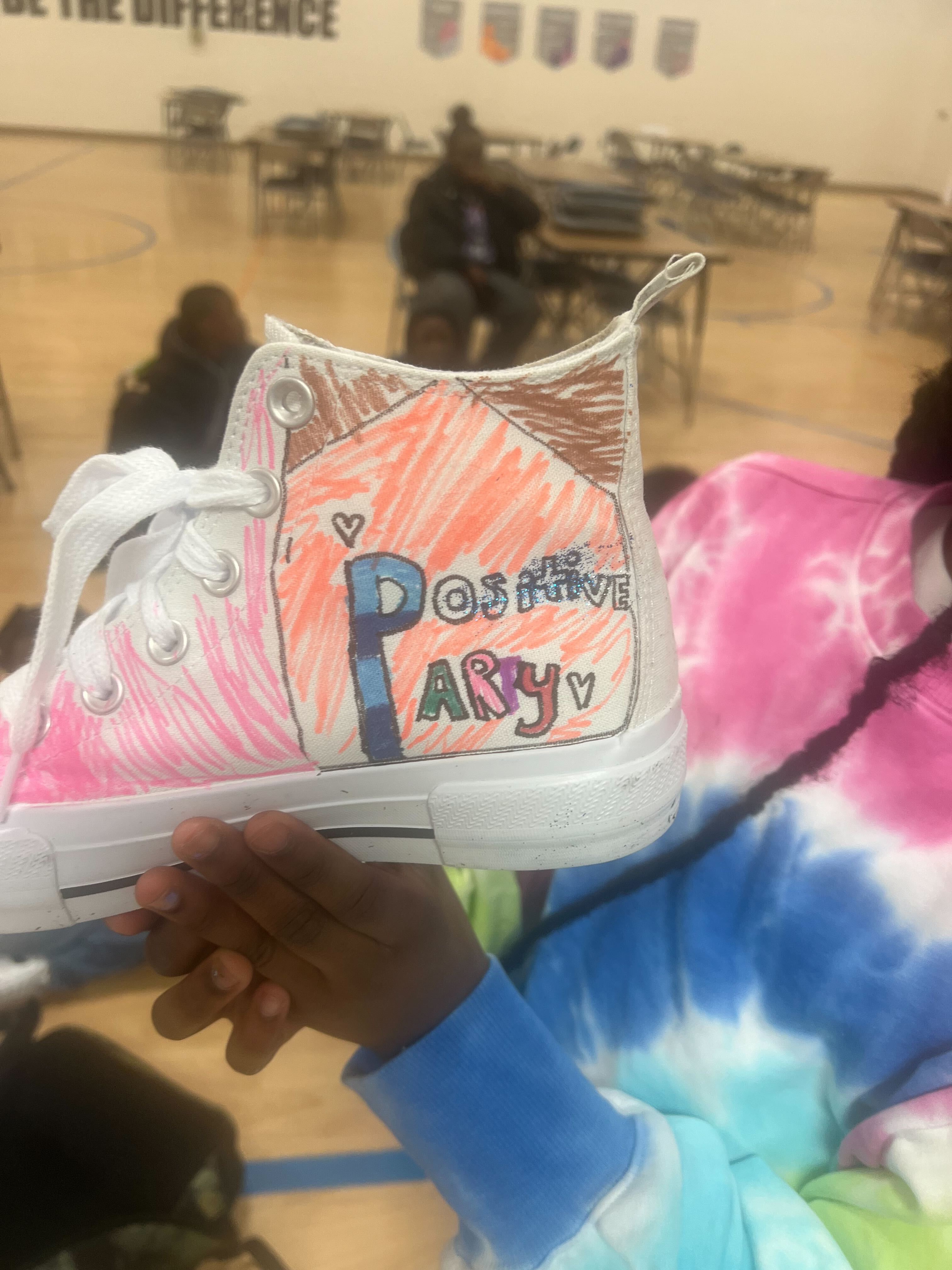 Students in the TLC Program shouting "I soar with WINGS. Let me tell you why."