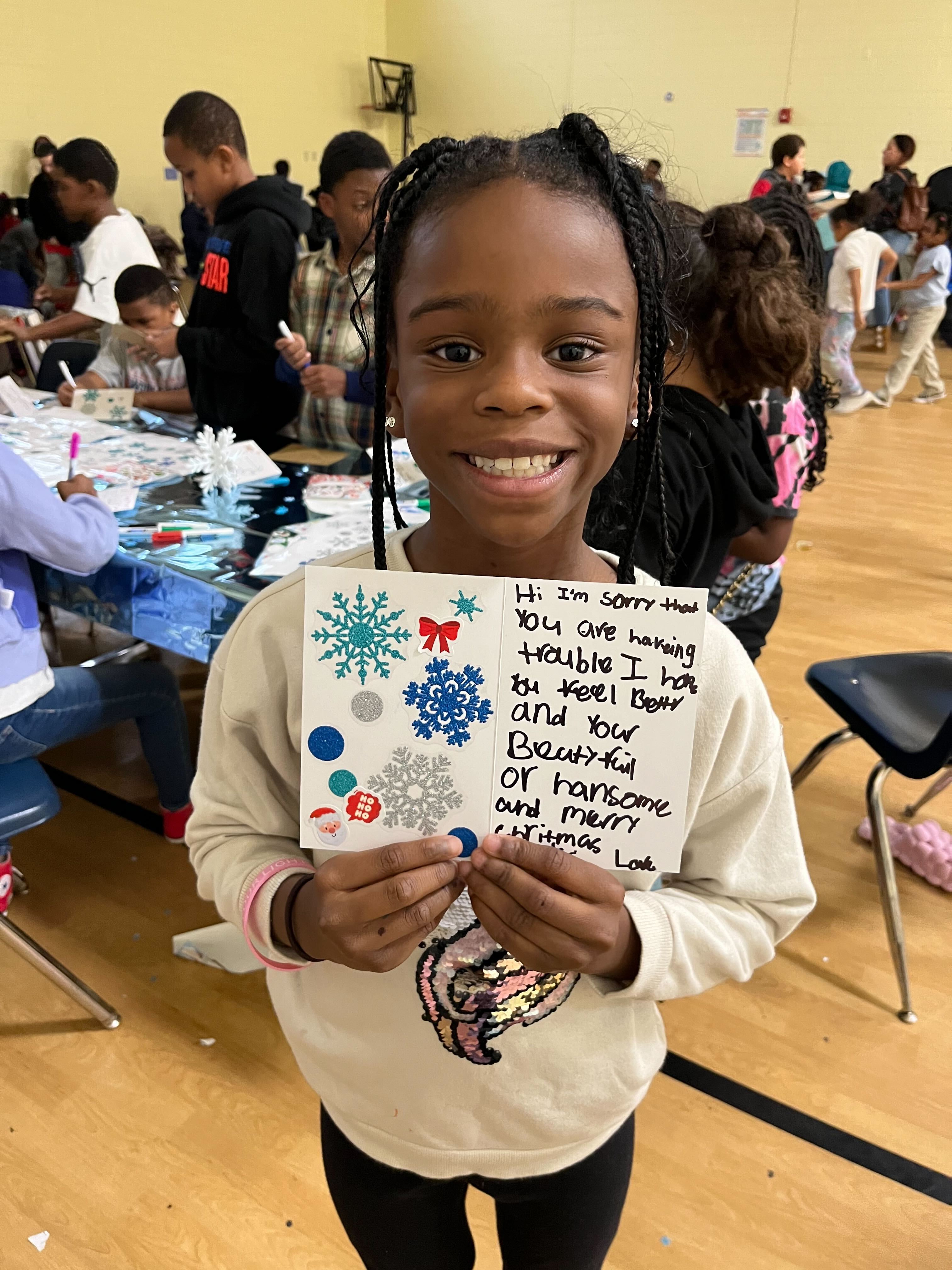 WINGS Kid Holding a Card