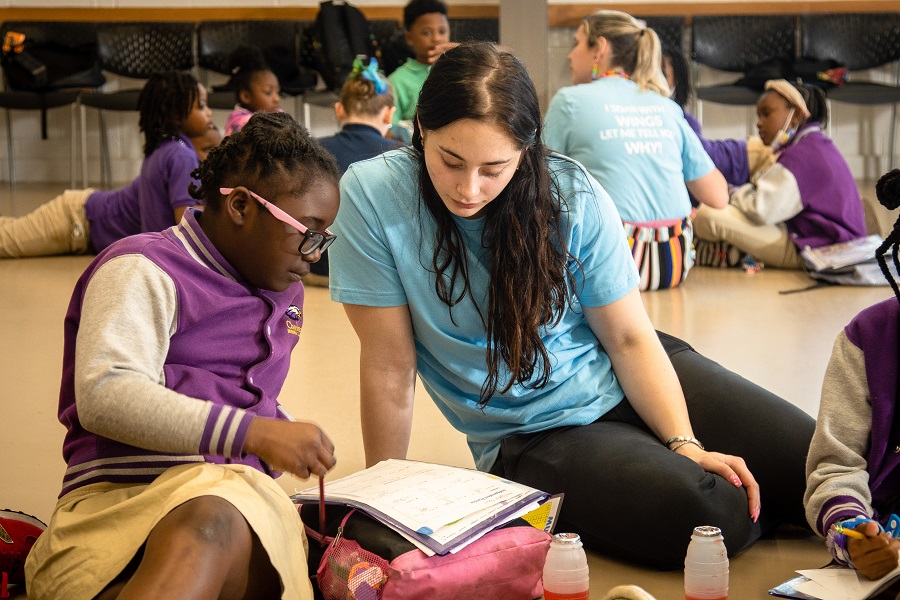 Tutor Helps School Girl with Homework
