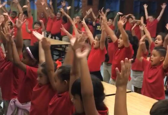 Students in the TLC Program shouting "I soar with WINGS. Let me tell you why."