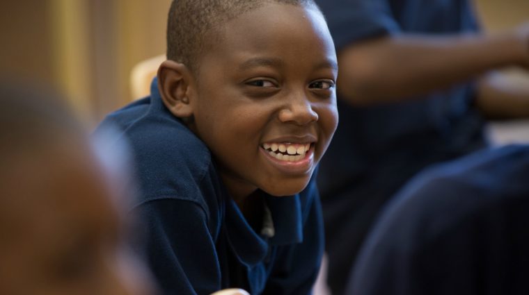 Happy School Boy has Big Smiles for Wings