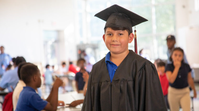 School Boy in Graduation Cap and Gown