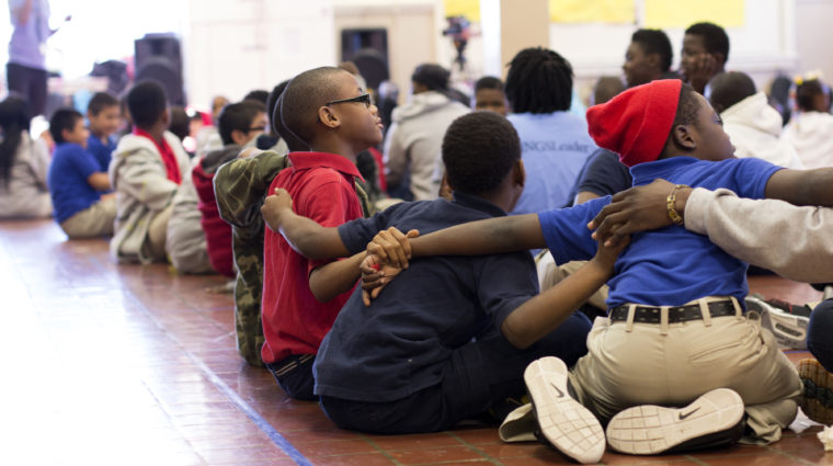 Groups of School Boys Huddling in Circles on the Floor